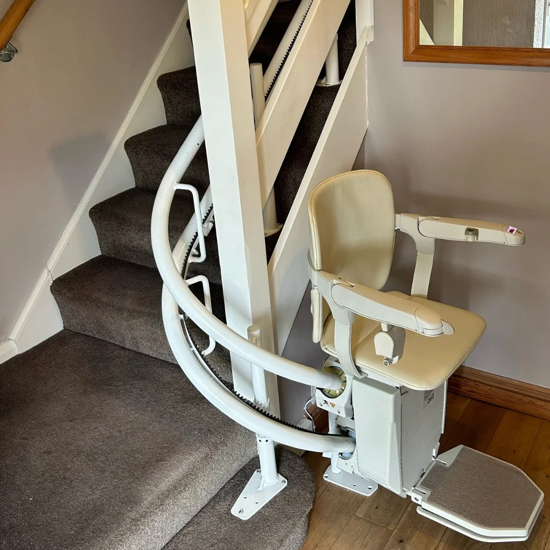Curved stairlift on a staircase with a bend in a UK home