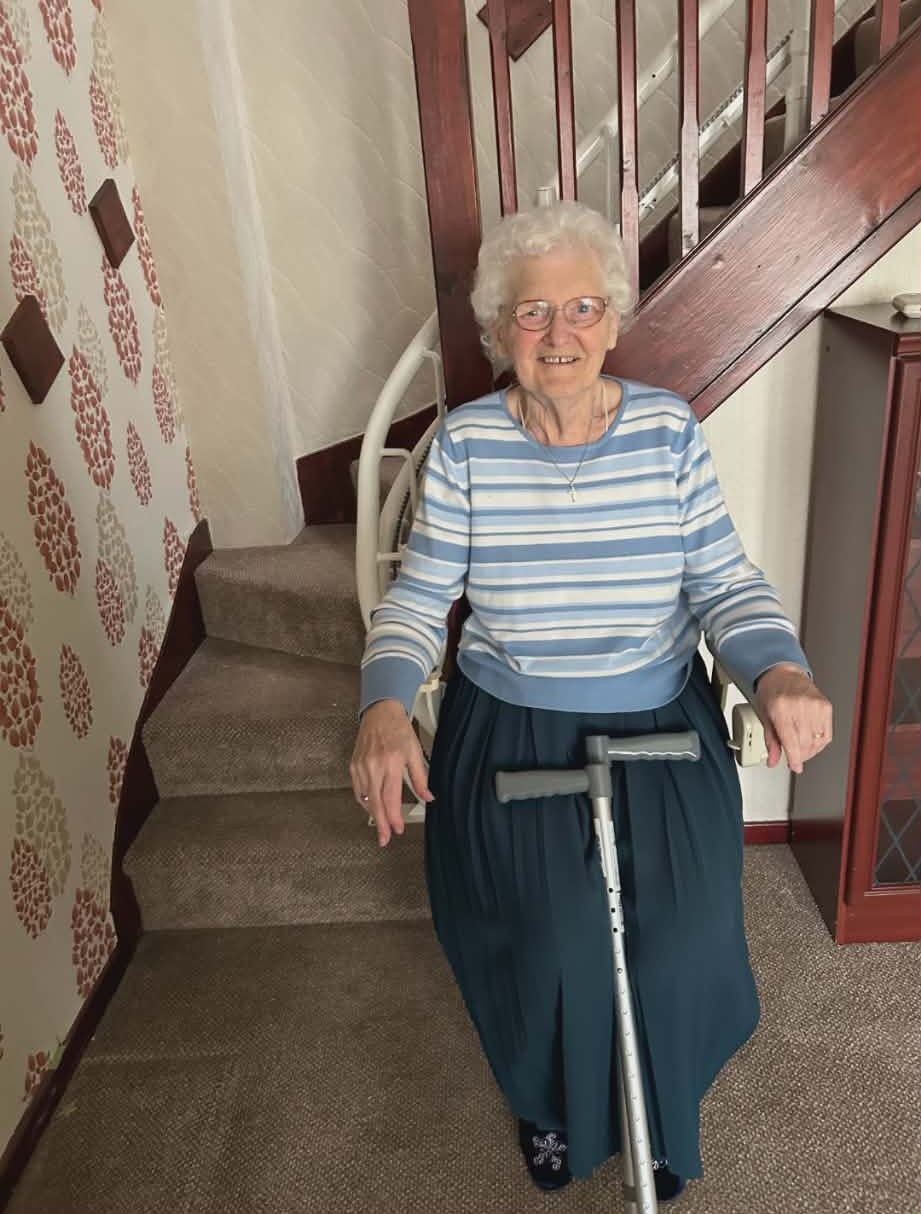 Audrey, 89, on her stairlift at home in Selby